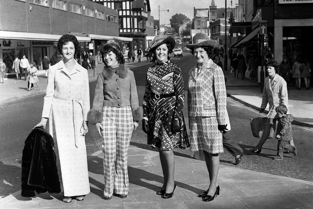 An impromptu fashion line-up by women from Debenhams, promoting a forthcoming show at the store on Standishgate in 1973