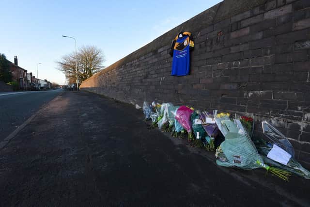 Flowers at the scene of a hit and run where Gareth "Gaz" Roper died on Lily Lane, Bamfurlong, on January 1 2022