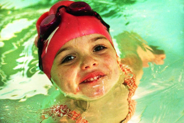 Water baby Charlotte Greenhalgh who had eight swimming badges to her credit and had just received her 200m award at the age of four in February 1998.