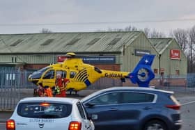 The air ambulance landed near Woodhouse Lane in Wigan