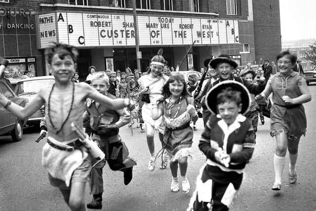 RETRO 1968 - Wigan's ABC Cinema was overun with junior cowboys and indians as ABC Minors Club members enacted scenes from the film Custer of the West  on Station Road in the town centre .