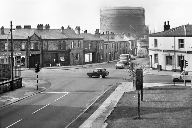 The junction of Darlington Street and Warrington Lane with the Foundry Inn on the right and Wigan gas works in the background in the late 1960s.