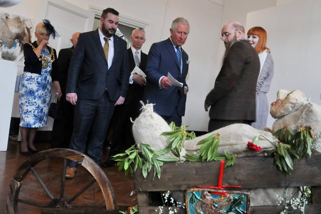 Prince Charles meets artists from Cross Street Arts, Standish, during a visit to The Old Courts, Wigan.  April 2019