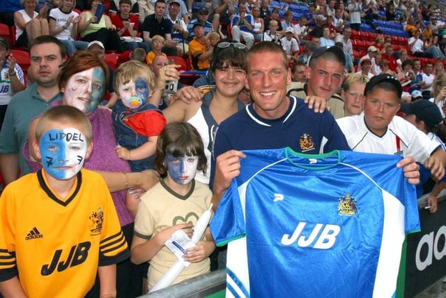 Wigan Athletics NEW Skipper Canadian Jason De Vos shows fans the new home kit.