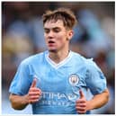 Wiganer Jacob Wright earned praise from Pep Guardiola after making his debut for Manchester City against Huddersfield on Sunday
