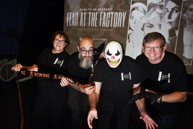 Members of Leigh Film Factory, from left, Elizabeth Costello, Kevin Lowe, Rob Tongeman (in a mask) and Paul Costello, are celebrating Halloween with a  month-long film special, Fear at the Factory, showing at the independent cinema based at Leigh Spinners Mill.