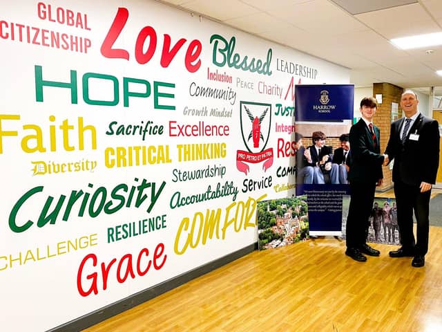 Morgan and Headteacher, Mr Dumican congratulating him on his success