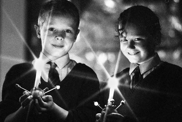 Pupils of Ince CE Primary School David Hatton and Joanne Lindley who took part in a Christingle service at the school on Tuesday 19th of December 1989.