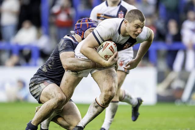 France get to grips with Ethan Havard.