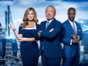 Sir Alan Sugar flanked by fellow Apprentice judges Baroness Brady and Tim Campbell