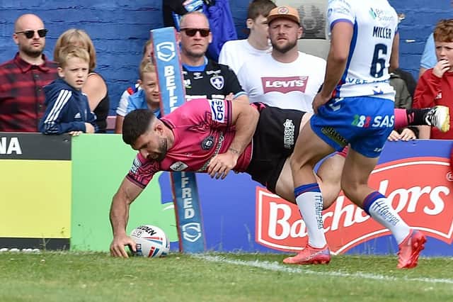 Abbas Miski crosses for one of his two tries at Wakefield