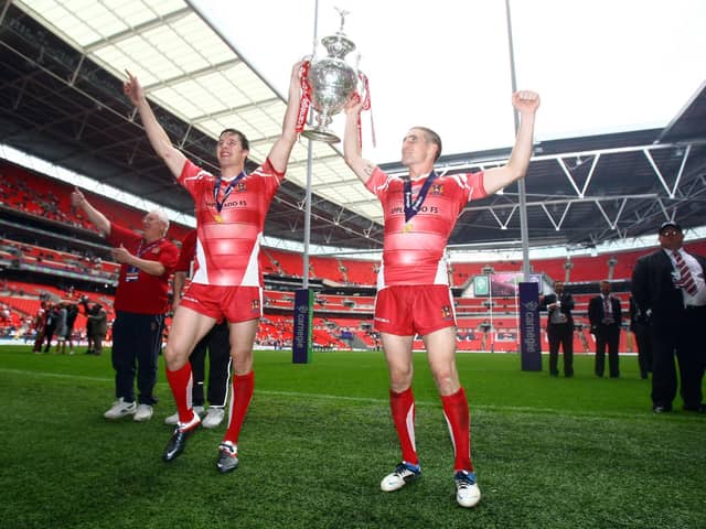 Joel Tomkins and Sam Tomkins celebrate winning the Challenge Cup in 2011