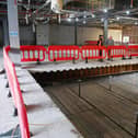 A large rectangular hole has been cut in the upper floor of the former Debenhams. At the moment dropboards, otherwise known as a crash deck, are in place to stop debris falling to the ground. Soon they will be removed