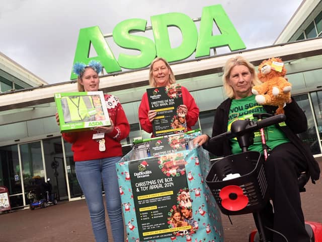 Katie Wilkes and Maureen Holcroft, from Daffodils Dreams, launch the Christmas Eve box and toy appeal with Maria Edwards, Asda's community champion, right