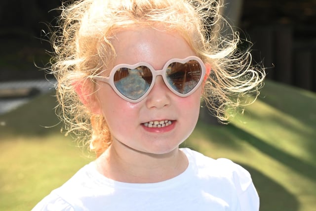 Rosie, three, has fun in the sun at Haigh Woodland Park, Wigan.