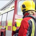 Firefighters were forced to cause damage to the interior of the home in order to get at a blaze in the wall cavity