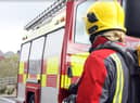 Firefighters were forced to cause damage to the interior of the home in order to get at a blaze in the wall cavity