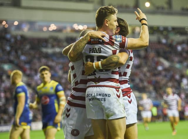 Jai Field celebrates one of Wigan's tries