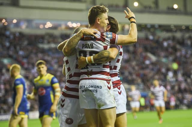 Jai Field celebrates one of Wigan's tries