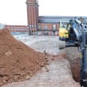 Digging deep: one of the trenches being created by archaeologists on the site of the former Galleries shopping centre in Wigan