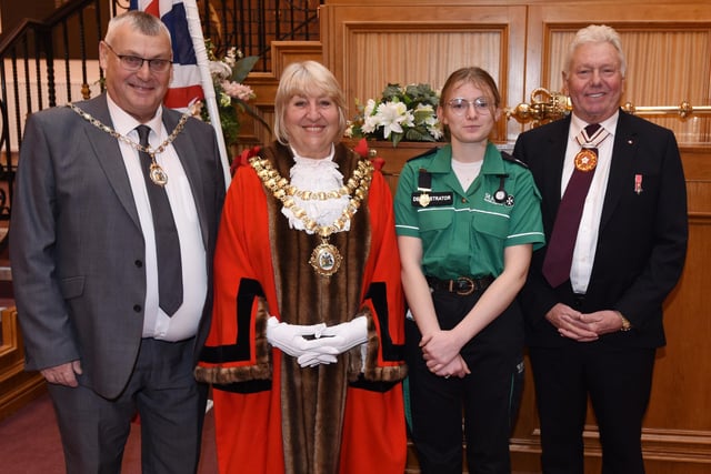 from left, The Mayor's consort Coun Clive Morgan,  Mayor of Wigan Coun Marie Morgan, the Mayor's cadet Jess McGowan and Deputy Lieutenant of Greater Manchester Martin Ainscough, at the monthly Wigan British Citizenship ceremony at Wigan Town Hall.