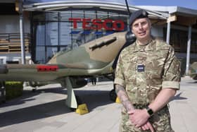 Anthony Morris (RAF Reserves) stands in front of an RAF Hurricane at the entrance to Tesco head office. Military chefs took part in a live cook off, hosted by the supermarket chain, to mark Armed Forces Week.