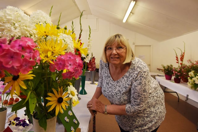 Jean Hayes admires the flowers on display