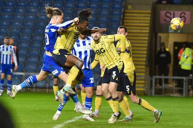 Thelo Aasgaard heads home against Oxford after Jonny Smith (far left) sent over an inviting delivery