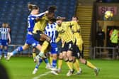 Thelo Aasgaard heads home against Oxford after Jonny Smith (far left) sent over an inviting delivery