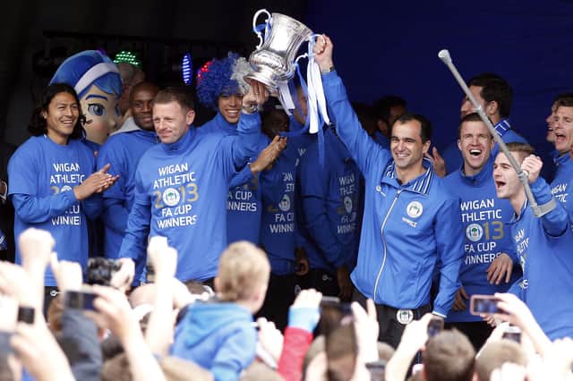 Wigan Athletic manager Roberto Martinez (right) and his team on stage during the FA Cup trophy parade in Wigan.
