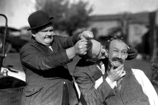 Left to right: Oliver Hardy, Stan Laurel and their old nemesis James Finlayson in Big Business (1929)