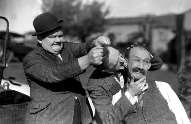Left to right: Oliver Hardy, Stan Laurel and their old nemesis James Finlayson in Big Business (1929)