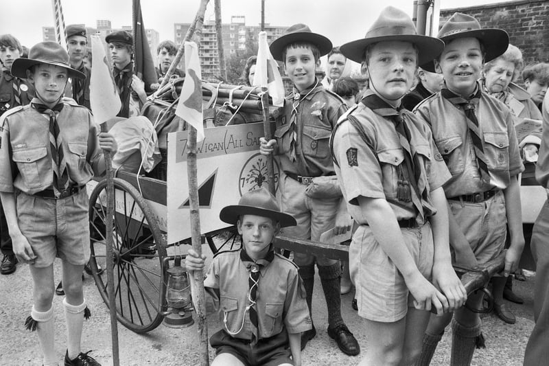 Members of the 7th Wigan All Saints Scouts dressed in the uniform from an earlier era to celebrate the 75th anniversary of the scout movement at the St. George's Day parade on Sunday 24th of April 1983.