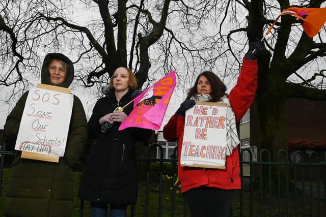 NEU members carried placards and waved flags on the picket line at St Paul's CE Primary School