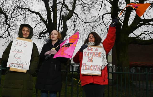 NEU members carried placards and waved flags on the picket line at St Paul's CE Primary School