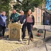 (L-R) Coun Chris Ready, volunteer Brian Muscroft, Coun Ron Conway and Coun Laura Flynn with the Moot Hall slab