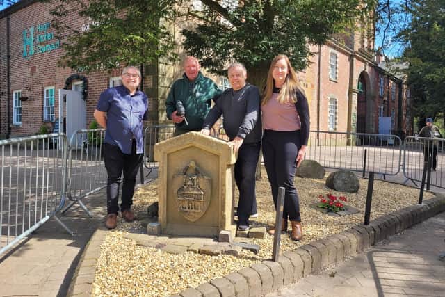 (L-R) Coun Chris Ready, volunteer Brian Muscroft, Coun Ron Conway and Coun Laura Flynn with the Moot Hall slab