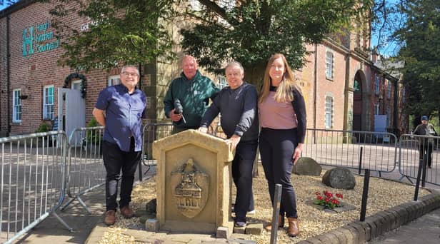 (L-R) Coun Chris Ready, volunteer Brian Muscroft, Coun Ron Conway and Coun Laura Flynn with the Moot Hall slab