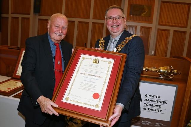 A group of former councillors with more than 120 years service in the Wigan Borough attend a special presentation event at Wigan Council Chamber in Wigan Town Hall, as the six were announced as Honorary Aldermen for 2024.  The Mayor of Wigan Coun Kevin Anderson, right, makes a presentation to Billy Rotherham.
