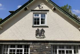 Wigan's coat of arms on the side of the Low Bank Ground building in Coniston
