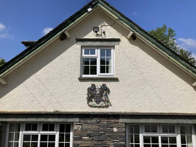 Wigan's coat of arms on the side of the Low Bank Ground building in Coniston