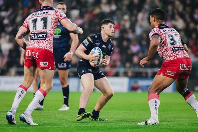 Jack Farrimond in action for Wigan Warriors against hometown club Leigh Leopards