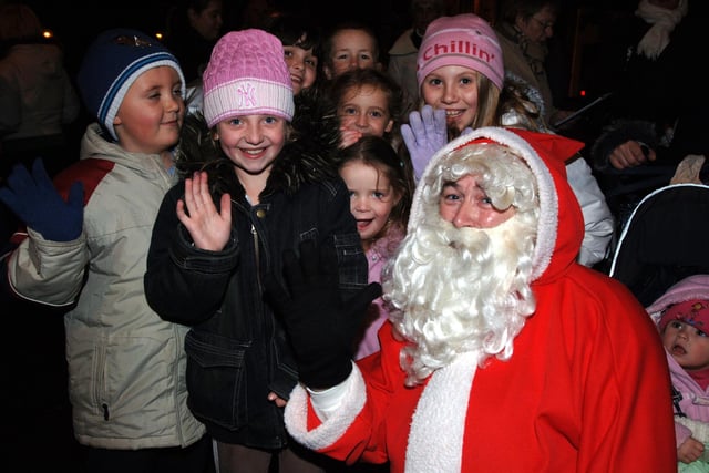 Excited youngsters greet Santa at the Golborne Christmas lights switch on .