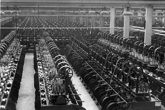 An early view of the inside of a cotton mill in Wigan borough