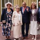 Sir Billy Boston stands with wife Joan, son Stephen and daughters Karen Murray and Christine Davies after receiving his knighthood