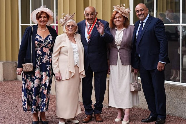 Sir Billy Boston stands with wife Joan, son Stephen and daughters Karen Murray and Christine Davies after receiving his knighthood