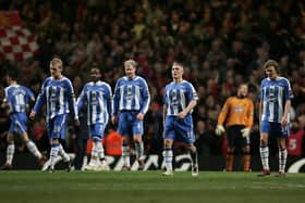 CARDIFF, UNITED KINGDOM - FEBRUARY 26: The Wigan Athletic players show their dejection during the Carling Cup Final match between Manchester United and Wigan Athletic at the Millennium Stadium on February 26, 2006 in Cardiff, Wales. (Photo by Phil Cole/Getty Images)