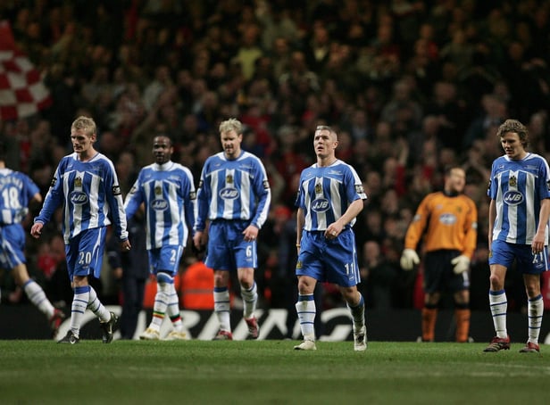 CARDIFF, UNITED KINGDOM - FEBRUARY 26: The Wigan Athletic players show their dejection during the Carling Cup Final match between Manchester United and Wigan Athletic at the Millennium Stadium on February 26, 2006 in Cardiff, Wales. (Photo by Phil Cole/Getty Images)