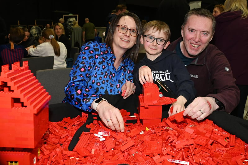 BLACKPOOL - 08-04-23  Lego fans enjoyed workshops, games, stalls and displays at Blackpool Brick Festival, held at the Winter Gardens, Blackpool.  Sarah and Paul Blackstock with Noah, eight, enjoy creating Lego builds.