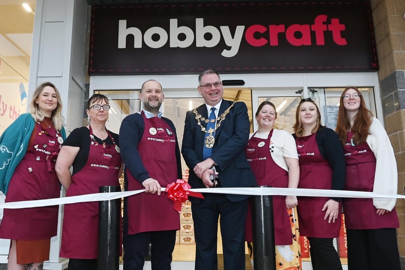 Staff members with the Mayor of Wigan Coun Kevin Anderson, as he gets ready to cut the ribbon to officially open the new store at Robin Park, Wigan.